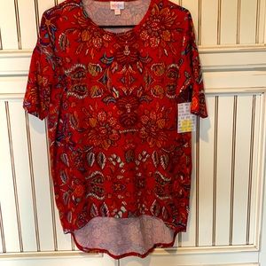 LuLaRoe Irma size extra extra small but these tops run very large and comfy